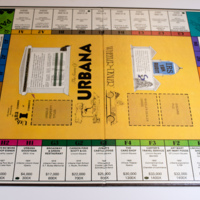 The Game of  Urbana: Board Game without Pieces